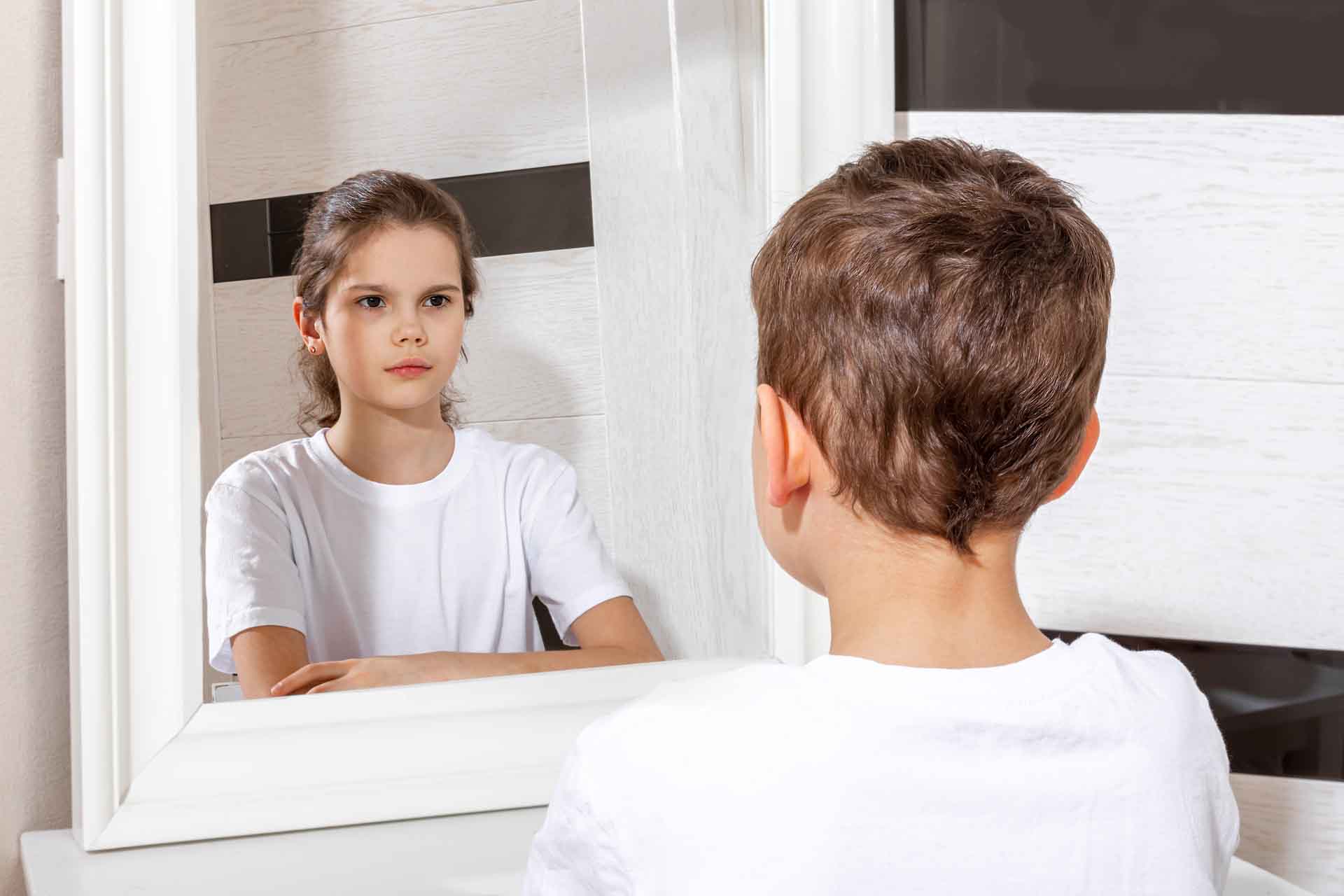 Reflection,Of,A,Boy,In,The,Mirror,By,A,Girl.
