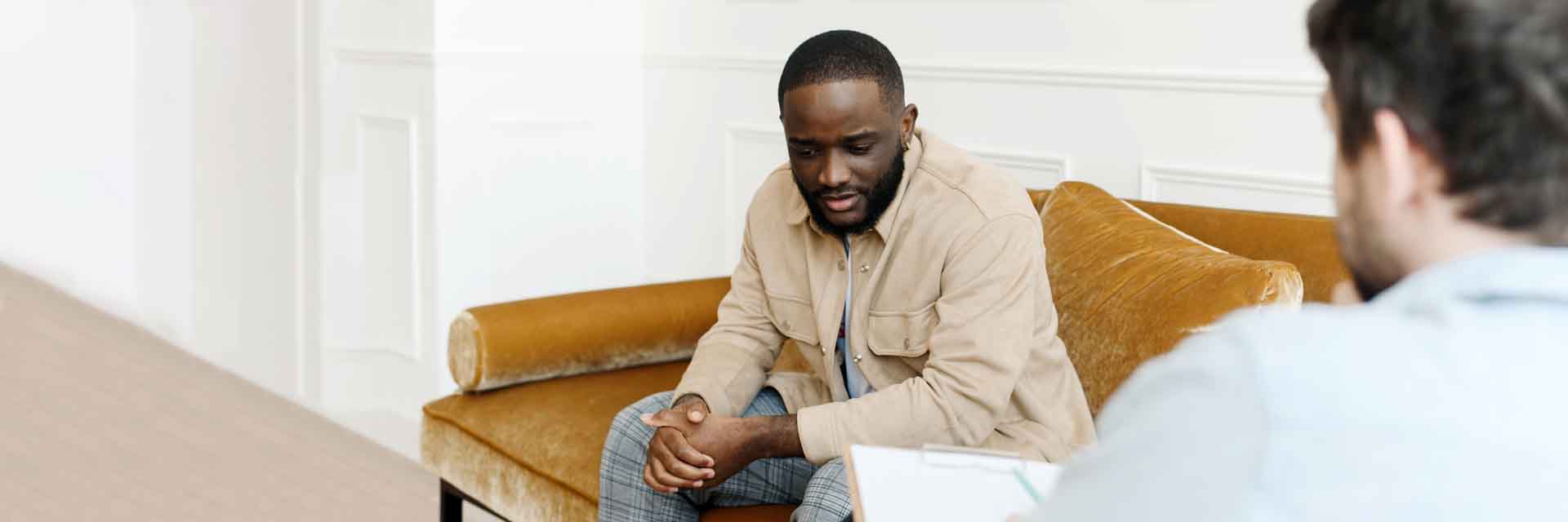 Unhappy,Young,Black,Man,Gay,Having,Session,With,Professional,Psychologist