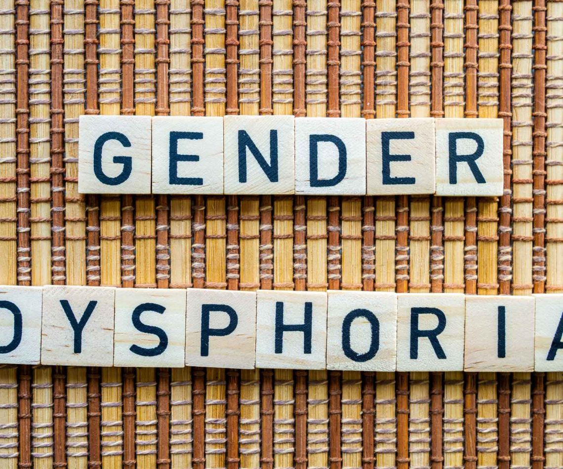Gender,Dysphoria,Concept,Word,In,Wooden,Letters,On,Straw,Mat