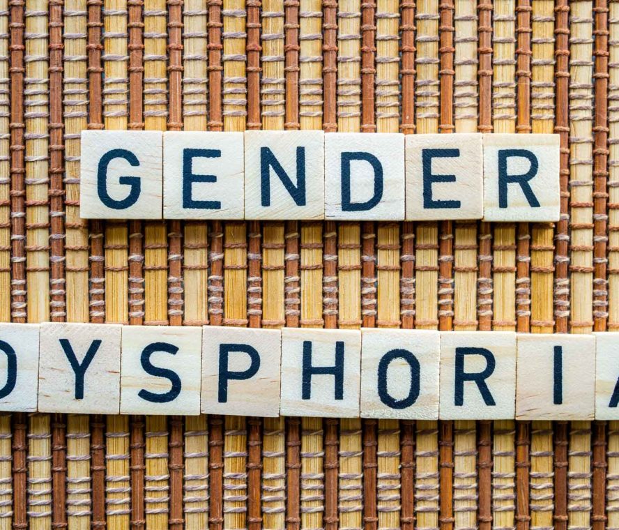 Gender,Dysphoria,Concept,Word,In,Wooden,Letters,On,Straw,Mat