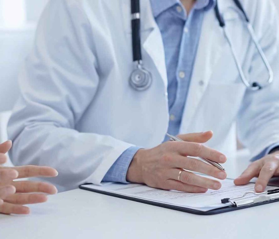 A,Doctor,And,A,Patient.,The,Physician,,Wearing,A,White